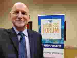 Dr. McGuinness presenting at the South Florida Business Forum about scams - 2017